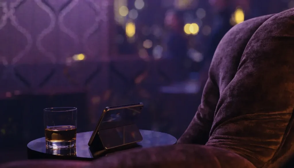Stylized British casino lounge scene with warm purple and amber lighting